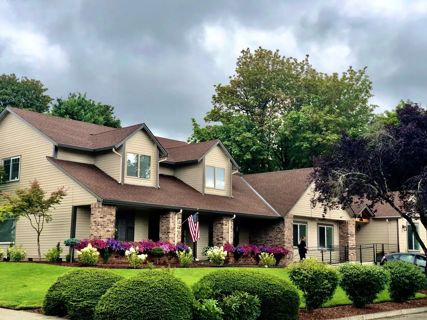 Fairway Home Care house exterior with seasonal flowers